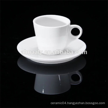 white porcelain coffee cup and saucer